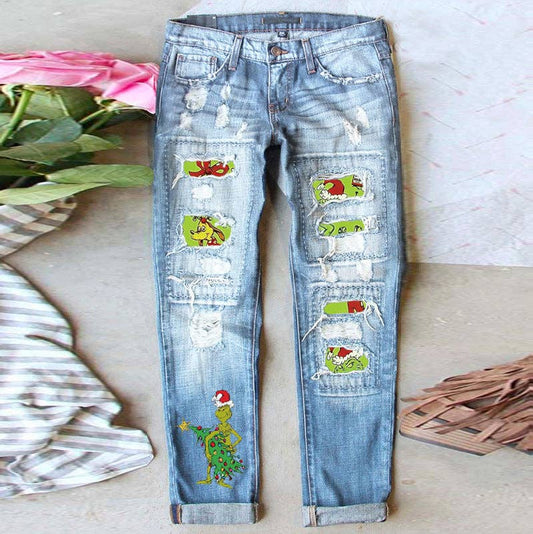 Women’s Light Wash Ripped Jeans with Christmas Grinch Patche